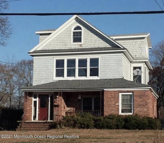 267 Roosevelt Ave, Oakhurst, NJ 07755 - view of front of home with brick siding and covered porch