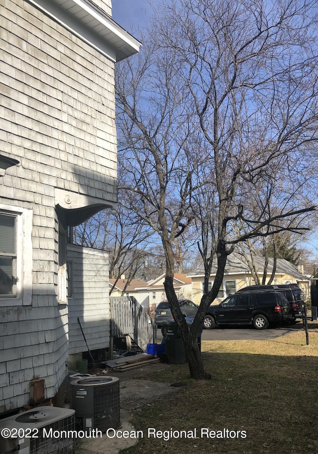 267 Roosevelt Ave, Oakhurst, NJ 07755 - view of side of home featuring a central AC unit
