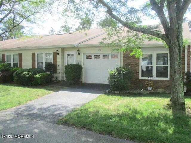 294 Marni Ln, Lakewood, NJ 08701 - ranch-style house with an attached garage, driveway, a front yard, and brick siding