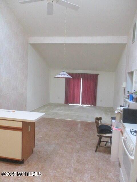 294 Marni Ln, Lakewood, NJ 08701 - kitchen with lofted ceiling, white gas range oven, ceiling fan, and open floor plan