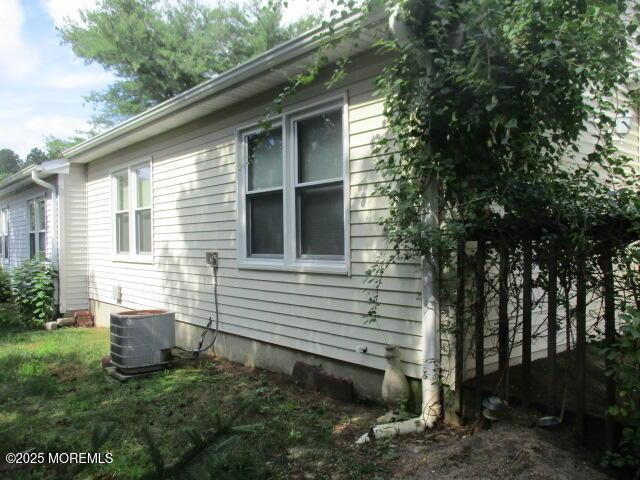 294 Marni Ln, Lakewood, NJ 08701 - view of side of home featuring a central AC unit