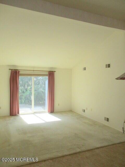 294 Marni Ln, Lakewood, NJ 08701 - carpeted spare room featuring vaulted ceiling