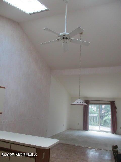 294 Marni Ln, Lakewood, NJ 08701 - unfurnished living room with lofted ceiling, carpet flooring, and ceiling fan
