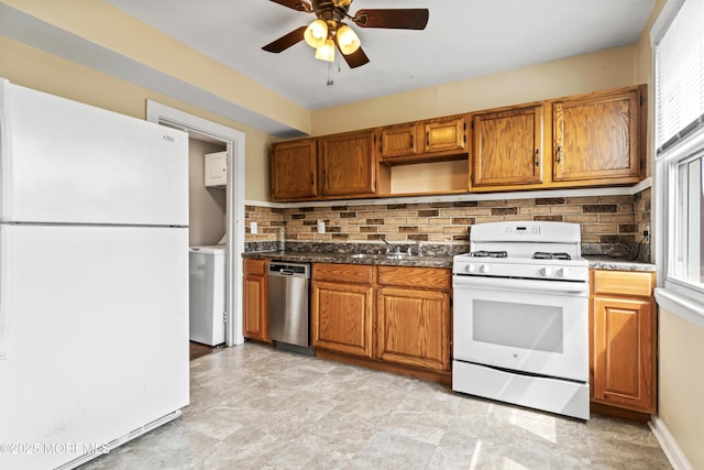 93 Barker Ave, Shrewsbury Twp, NJ 07724 - kitchen featuring white appliances, a ceiling fan, backsplash, brown cabinetry, and washer / dryer