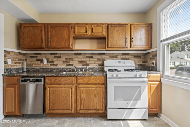 93 Barker Ave, Shrewsbury Twp, NJ 07724 - kitchen with white gas stove, dishwasher, tasteful backsplash, and brown cabinets