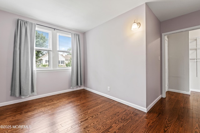 93 Barker Ave, Shrewsbury Twp, NJ 07724 - spare room with dark wood finished floors and baseboards