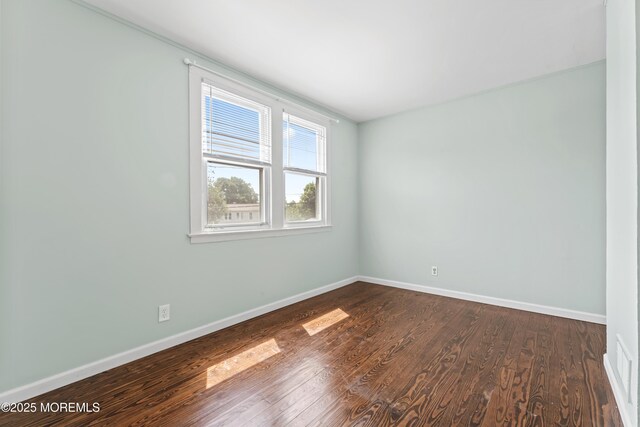 93 Barker Ave, Shrewsbury Twp, NJ 07724 - empty room with baseboards and dark wood-style flooring