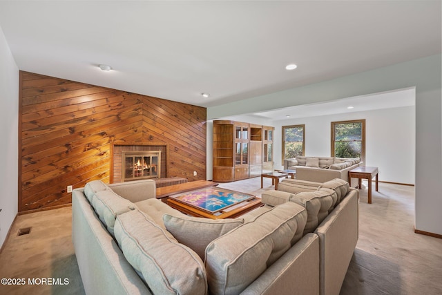 38 Pine St, Lincroft, NJ 07738 - living area featuring wood walls, light colored carpet, recessed lighting, and a fireplace