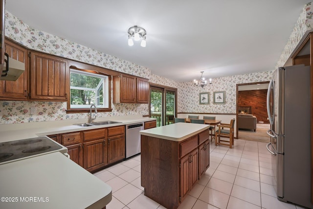 38 Pine St, Lincroft, NJ 07738 - kitchen featuring stainless steel appliances, wallpapered walls, a center island, a chandelier, and a wainscoted wall