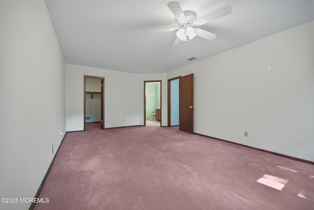 38 Pine St, Lincroft, NJ 07738 - unfurnished bedroom featuring carpet, a walk in closet, ensuite bath, a closet, and ceiling fan