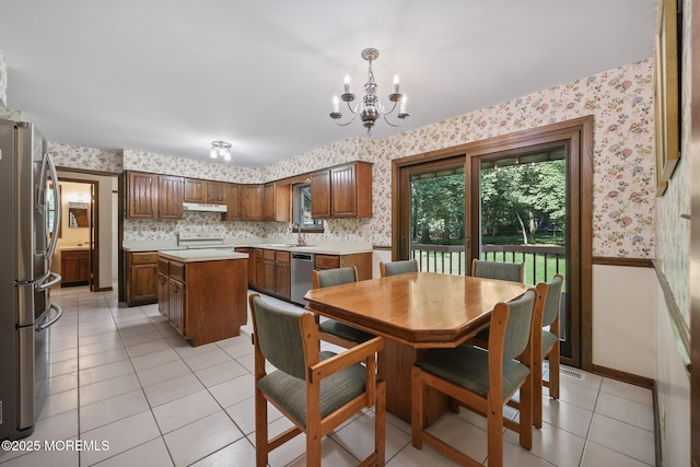 38 Pine St, Lincroft, NJ 07738 - dining area with wallpapered walls, a chandelier, and light tile patterned floors