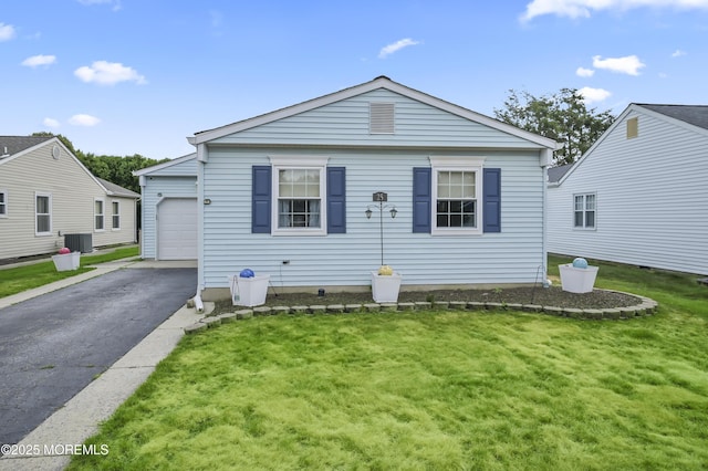 25 Tropicana Ct, Toms River, NJ 08757 - view of front of home featuring asphalt driveway, a front yard, and an attached garage