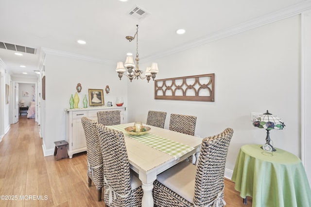 25 Tropicana Ct, Toms River, NJ 08757 - dining area with a chandelier, light wood-style flooring, crown molding, and recessed lighting