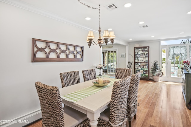 25 Tropicana Ct, Toms River, NJ 08757 - dining space with a chandelier, crown molding, recessed lighting, light wood-style floors, and a baseboard radiator
