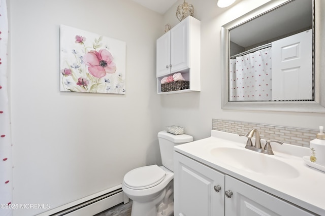 25 Tropicana Ct, Toms River, NJ 08757 - full bathroom featuring a baseboard radiator, decorative backsplash, and vanity