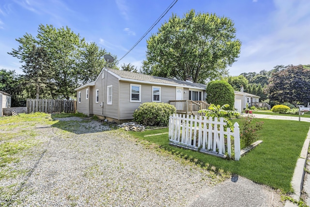 9 Frederick Dr, Bayville, NJ 08721 - view of front of home with driveway, an attached garage, and a chimney