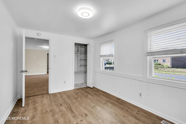 9 Frederick Dr, Bayville, NJ 08721 - unfurnished bedroom with light wood-style floors, a closet, and crown molding