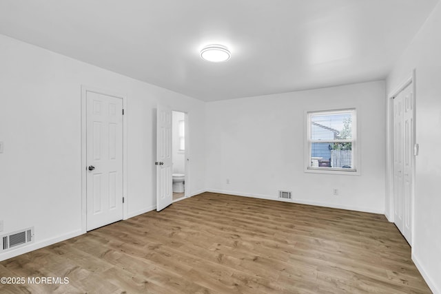 9 Frederick Dr, Bayville, NJ 08721 - unfurnished bedroom with light wood-style floors and ensuite bathroom