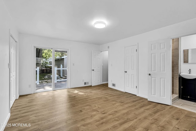9 Frederick Dr, Bayville, NJ 08721 - unfurnished bedroom featuring access to exterior, light wood finished floors, and ensuite bathroom