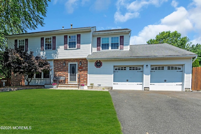 627 Meadow Run, Brick, NJ 08724 - view of front facade with driveway and an attached garage