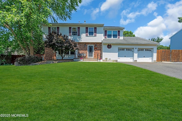627 Meadow Run, Brick, NJ 08724 - colonial house with asphalt driveway, a garage, and brick siding