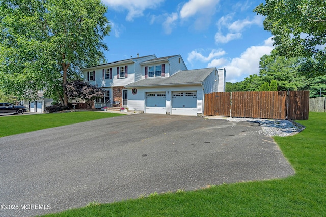 627 Meadow Run, Brick, NJ 08724 - view of front of house with driveway, a garage, and a chimney