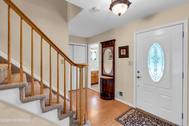 627 Meadow Run, Brick, NJ 08724 - entrance foyer with stairway and light wood finished floors