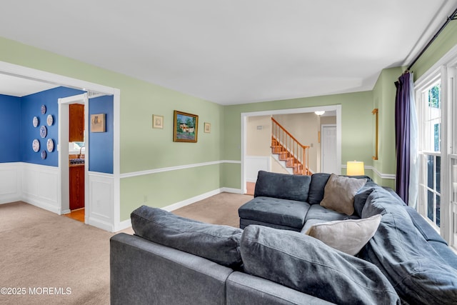 627 Meadow Run, Brick, NJ 08724 - living area featuring carpet, stairway, and wainscoting