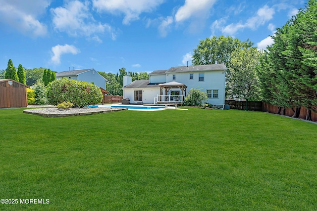 627 Meadow Run, Brick, NJ 08724 - rear view of property with a gazebo, a fenced backyard, and a storage unit