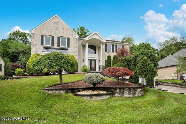 6 Opatut Ct, Morganville, NJ 07751 - view of front of house featuring a front lawn, brick siding, and french doors
