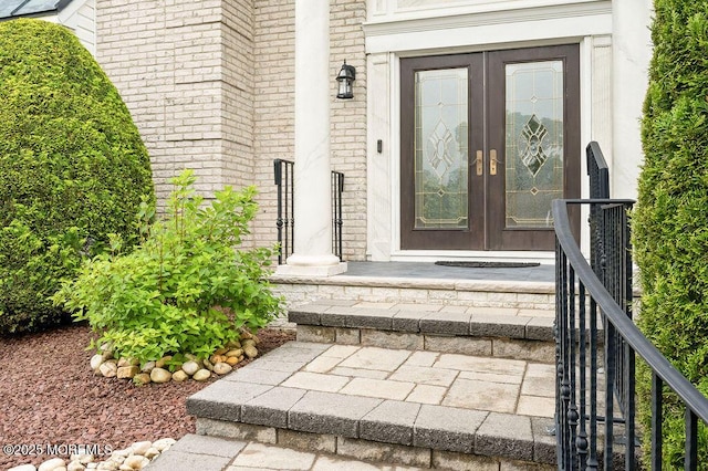 6 Opatut Ct, Morganville, NJ 07751 - view of exterior entry with french doors and brick siding
