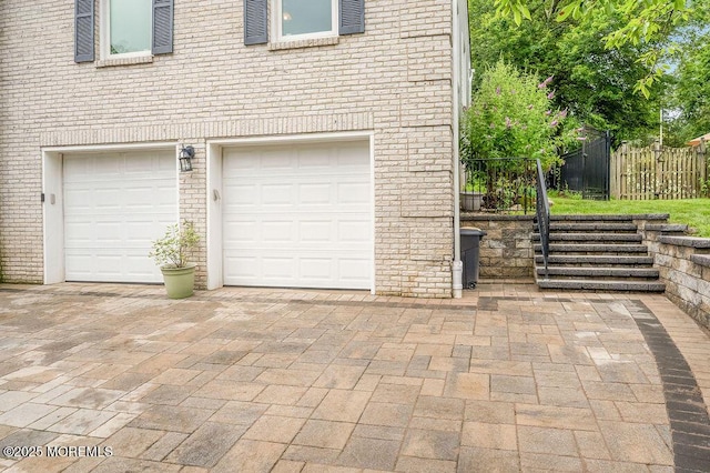 6 Opatut Ct, Morganville, NJ 07751 - garage with decorative driveway