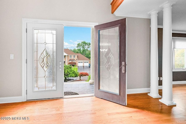 6 Opatut Ct, Morganville, NJ 07751 - foyer with wood finished floors, decorative columns, and crown molding