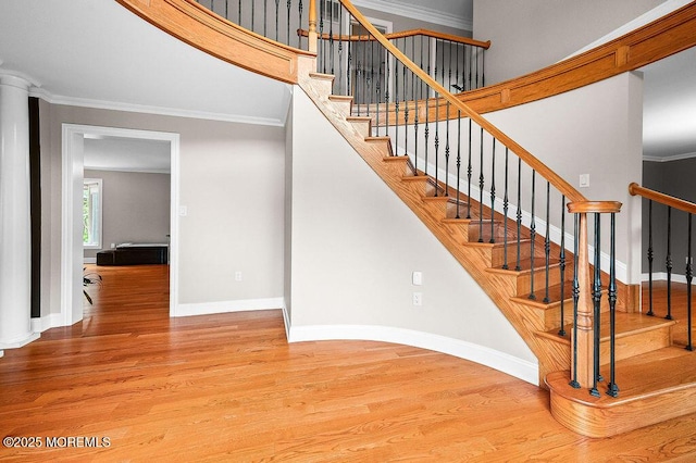 6 Opatut Ct, Morganville, NJ 07751 - staircase featuring wood finished floors and crown molding