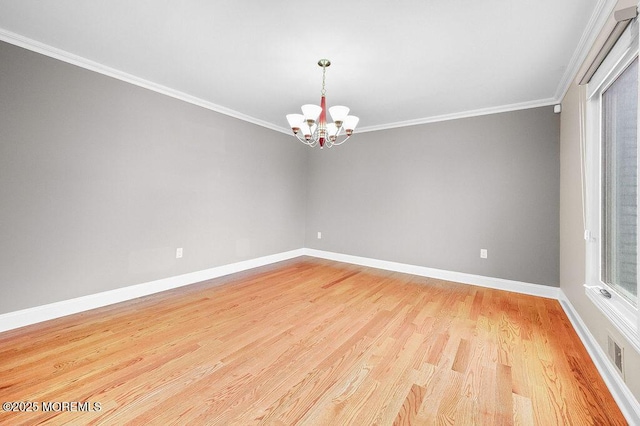 6 Opatut Ct, Morganville, NJ 07751 - empty room featuring a chandelier, light wood finished floors, and ornamental molding