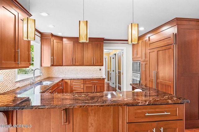 6 Opatut Ct, Morganville, NJ 07751 - kitchen featuring a peninsula, dark stone countertops, backsplash, recessed lighting, and decorative light fixtures