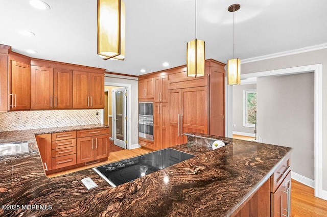6 Opatut Ct, Morganville, NJ 07751 - kitchen with black appliances, crown molding, light wood-type flooring, dark stone countertops, and backsplash
