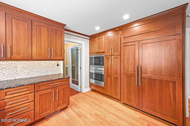 6 Opatut Ct, Morganville, NJ 07751 - kitchen with built in appliances, brown cabinetry, light wood-style flooring, recessed lighting, and crown molding