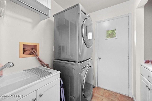 6 Opatut Ct, Morganville, NJ 07751 - laundry room with stacked washer and clothes dryer, cabinet space, and light tile patterned flooring
