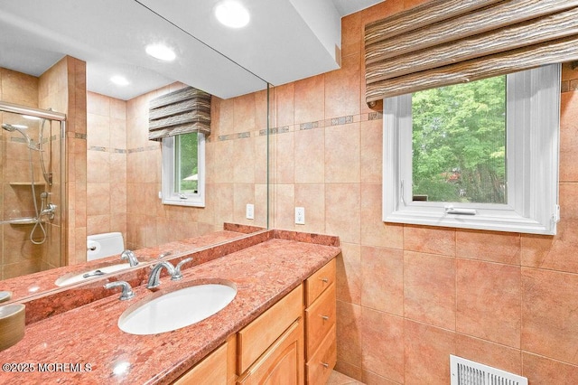 6 Opatut Ct, Morganville, NJ 07751 - full bathroom featuring a shower stall, vanity, and tile walls