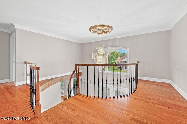 6 Opatut Ct, Morganville, NJ 07751 - stairs with a chandelier, wood finished floors, and ornamental molding