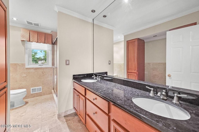 6 Opatut Ct, Morganville, NJ 07751 - bathroom featuring crown molding, double vanity, a stall shower, tile patterned flooring, and tile walls