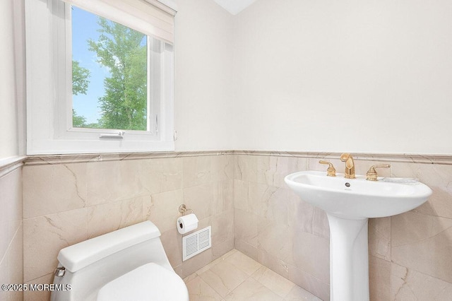 6 Opatut Ct, Morganville, NJ 07751 - bathroom with tile walls and wainscoting