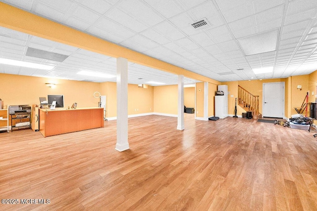 6 Opatut Ct, Morganville, NJ 07751 - finished below grade area with light wood-type flooring, stairway, and a drop ceiling