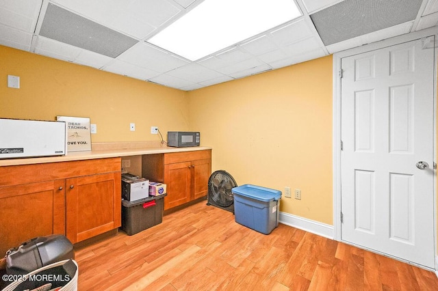 6 Opatut Ct, Morganville, NJ 07751 - miscellaneous room featuring light wood finished floors and a drop ceiling
