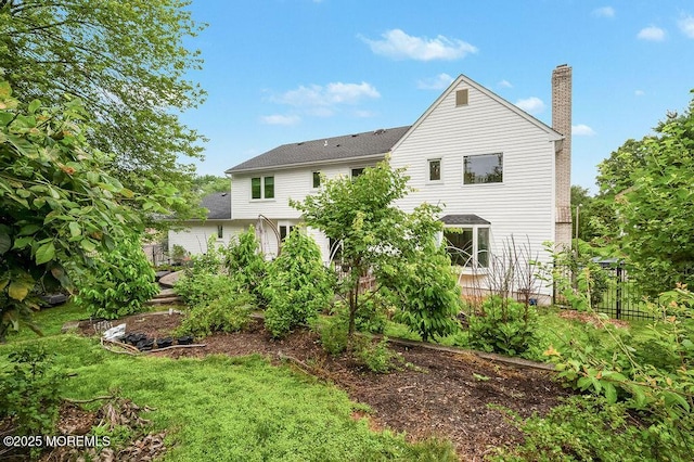 6 Opatut Ct, Morganville, NJ 07751 - rear view of house with a chimney