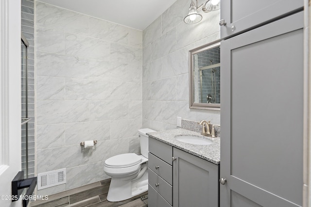 5 Maplecrest Ct, Toms River, NJ 08753 - full bathroom featuring tile walls, vanity, wood finished floors, and tiled shower