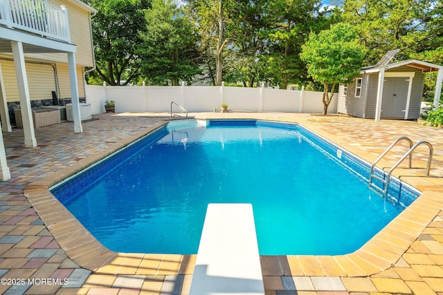 5 Maplecrest Ct, Toms River, NJ 08753 - view of pool featuring a patio area, a diving board, a storage unit, and view of scattered trees