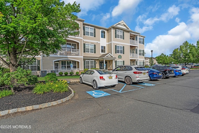 215 Sloan Ct, Matawan, NJ 07747 - view of building exterior featuring uncovered parking