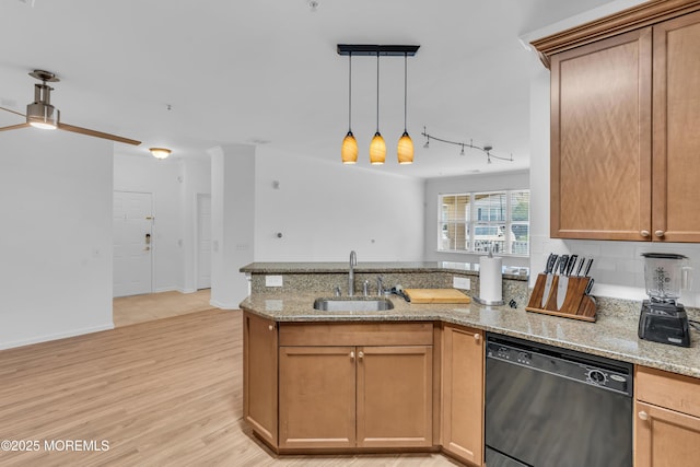215 Sloan Ct, Matawan, NJ 07747 - kitchen with black dishwasher, a peninsula, hanging light fixtures, and light stone countertops
